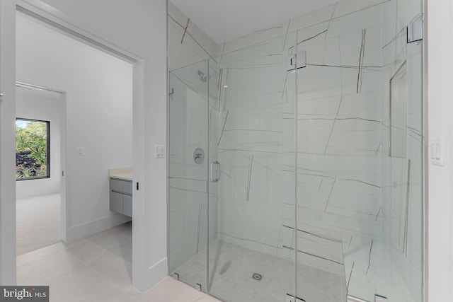 bathroom featuring vanity, tile patterned floors, and walk in shower