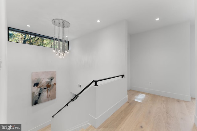 stairs featuring hardwood / wood-style flooring