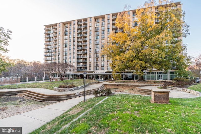 view of property's community with a yard