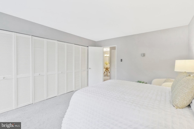 bedroom featuring a closet and carpet floors