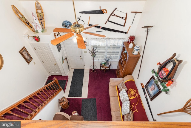 tiled foyer entrance featuring ceiling fan