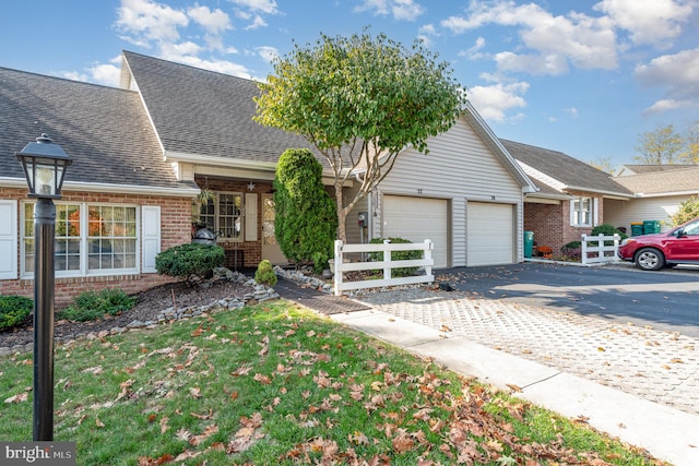 view of front facade with a front yard and a garage