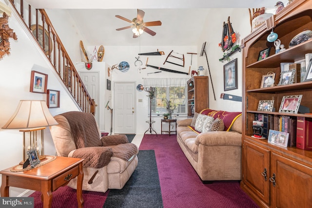 carpeted living room with ceiling fan