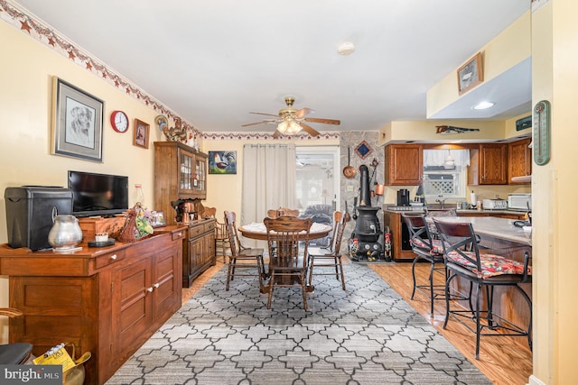 dining room featuring light hardwood / wood-style flooring and ceiling fan