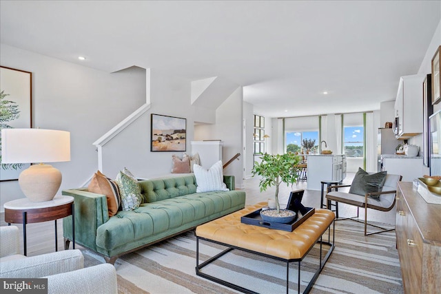 living room featuring light carpet