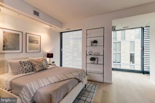 bedroom with light hardwood / wood-style floors