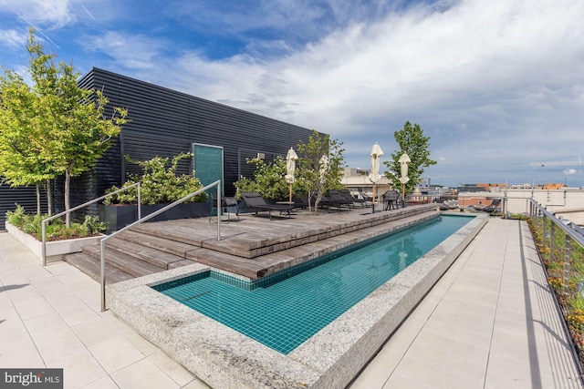 view of pool featuring a patio