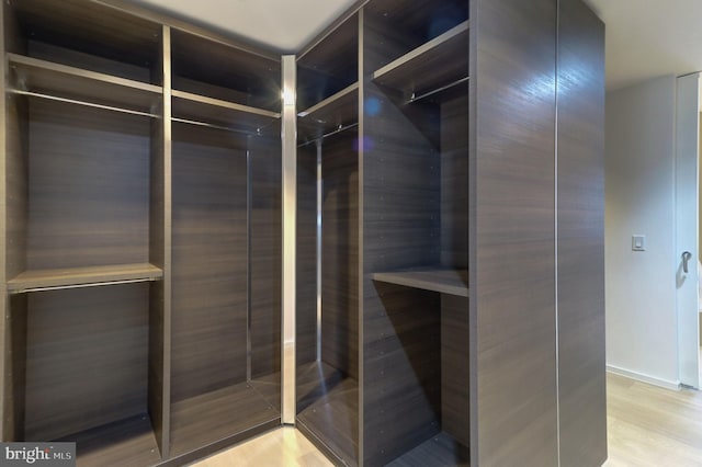 walk in closet featuring light wood-type flooring