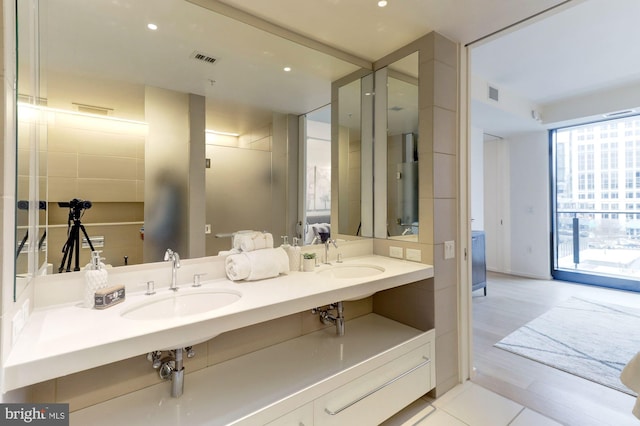 bathroom featuring vanity and hardwood / wood-style flooring