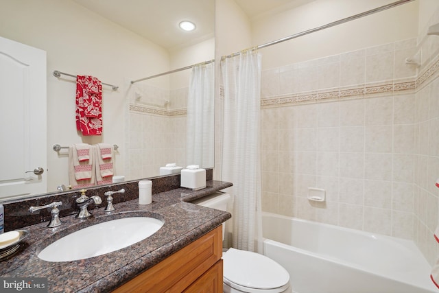 full bathroom with vanity, toilet, and shower / bath combo with shower curtain