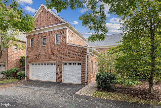 view of side of property with a garage