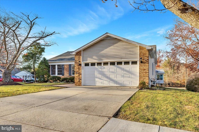 view of front of home featuring a front yard and a garage