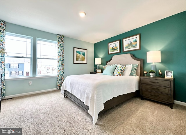 bedroom featuring light carpet