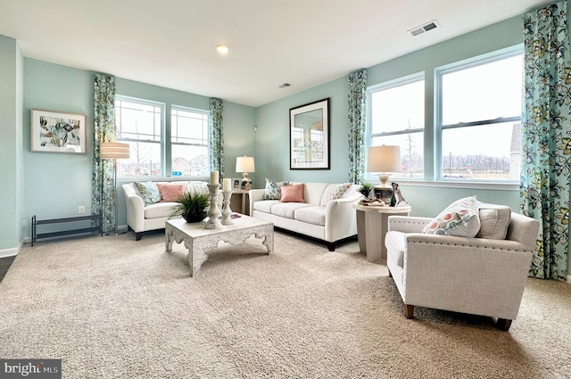 living room featuring carpet floors and plenty of natural light