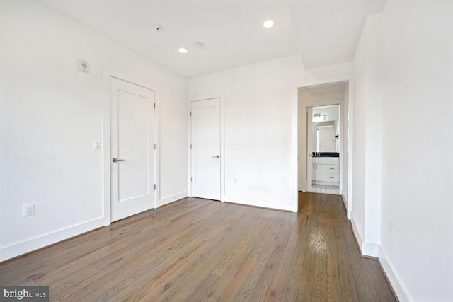 unfurnished room with hardwood / wood-style floors