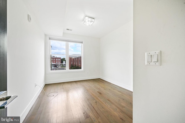 spare room featuring hardwood / wood-style floors