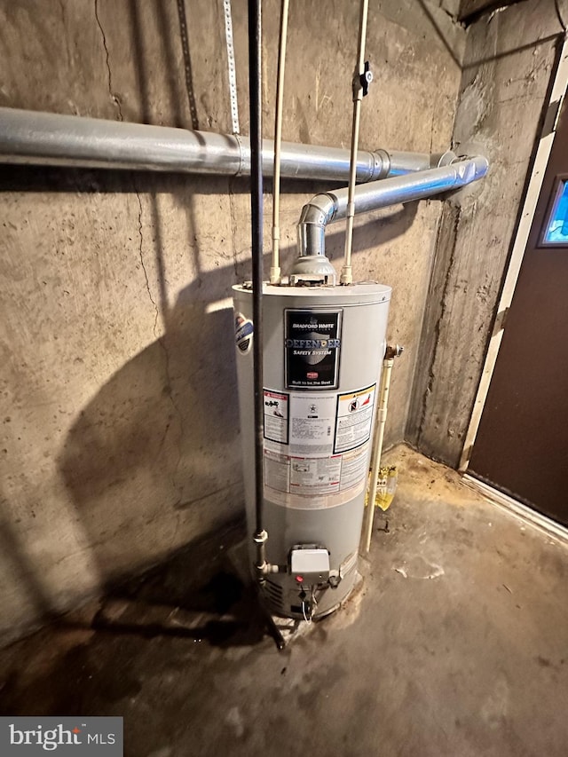 utility room featuring gas water heater