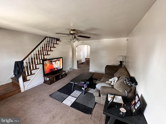 carpeted living room featuring ceiling fan