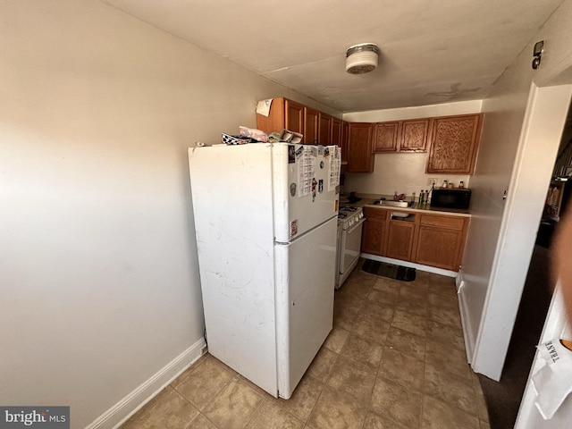 kitchen with sink and white appliances