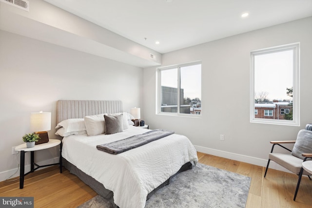 bedroom with light hardwood / wood-style floors