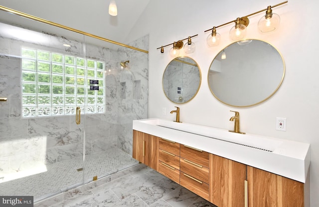 bathroom with vanity, vaulted ceiling, and tiled shower