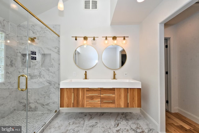 bathroom with vanity and an enclosed shower