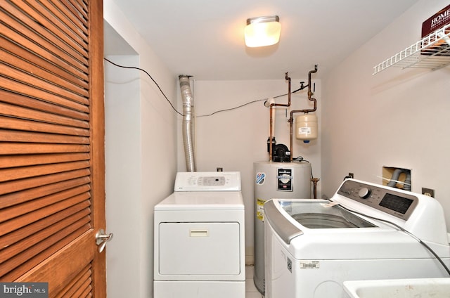 washroom featuring independent washer and dryer and gas water heater