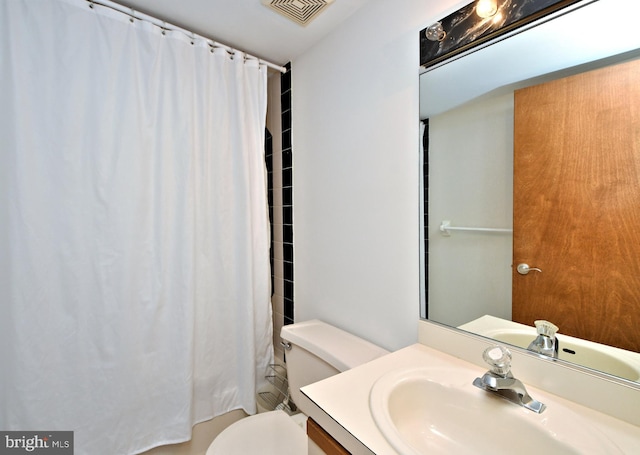 full bathroom with vanity, shower / bath combination with curtain, and toilet