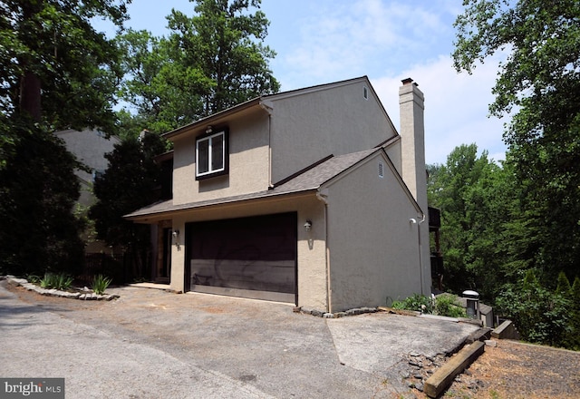 view of property exterior with a garage