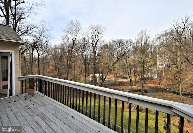 wooden terrace with a yard