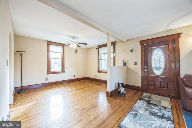 entrance foyer with ceiling fan, light hardwood / wood-style floors, and a healthy amount of sunlight