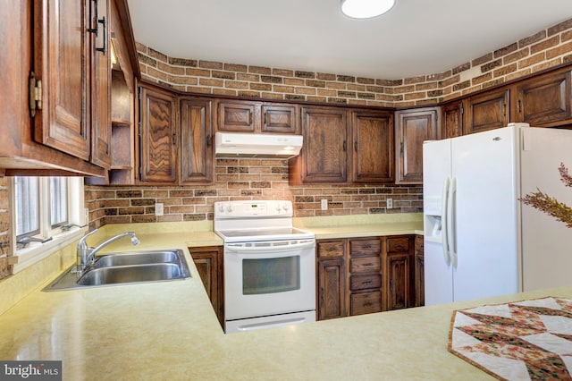 kitchen featuring sink and white appliances