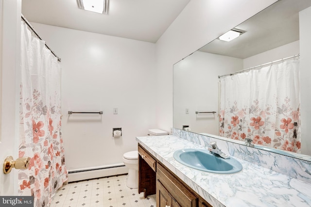 bathroom featuring vanity, toilet, and a baseboard heating unit