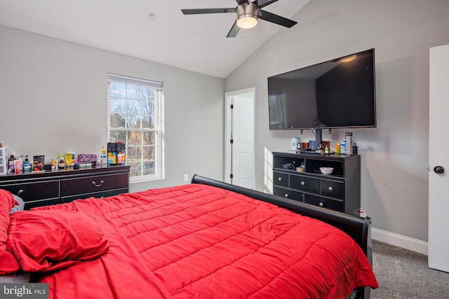 carpeted bedroom with ceiling fan and vaulted ceiling