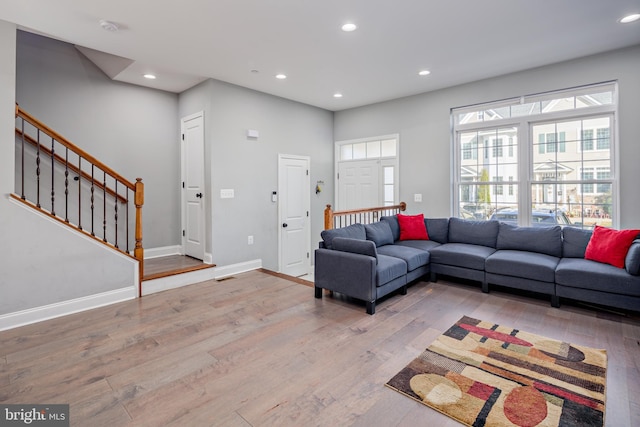 living room with light hardwood / wood-style flooring