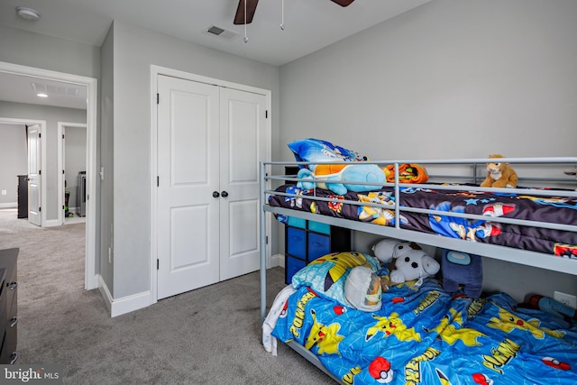 carpeted bedroom with ceiling fan and a closet