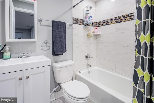 full bathroom featuring vanity, shower / bath combination with curtain, and toilet