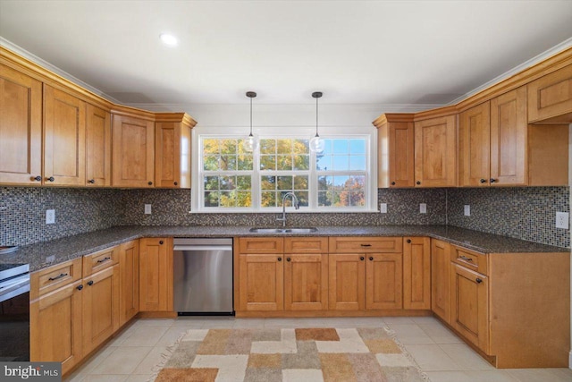 kitchen with sink, dishwasher, pendant lighting, and tasteful backsplash