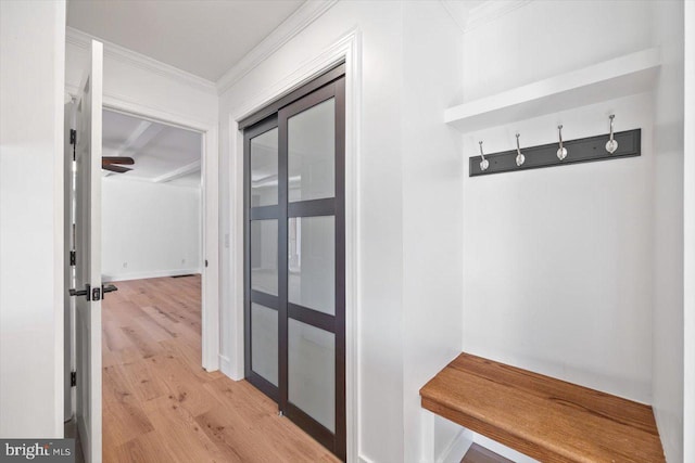 mudroom featuring light hardwood / wood-style floors and ornamental molding