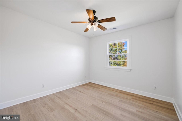 empty room featuring light hardwood / wood-style floors and ceiling fan