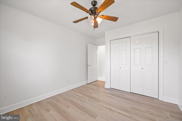 unfurnished bedroom with a closet, ceiling fan, and light hardwood / wood-style flooring