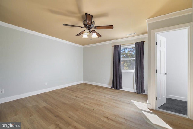 unfurnished bedroom with crown molding, light wood-type flooring, and ceiling fan