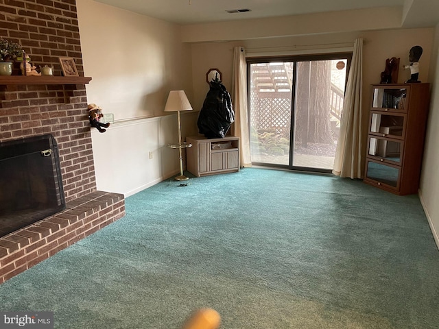 unfurnished living room with carpet flooring and a brick fireplace