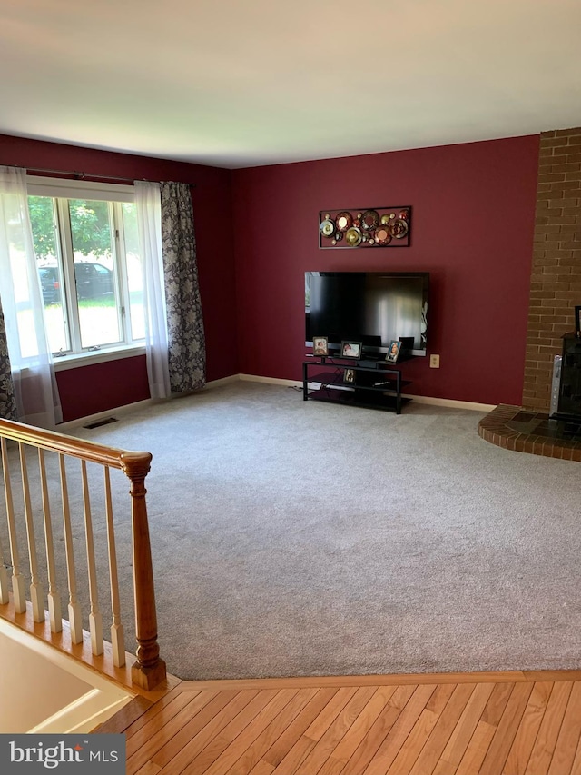 unfurnished living room with carpet flooring