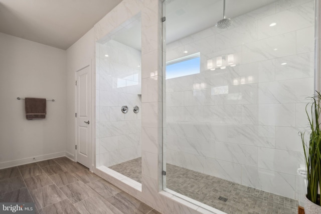 bathroom with tiled shower