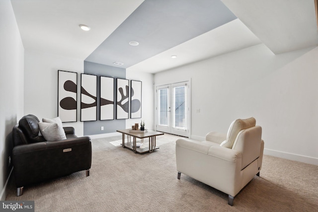 living room featuring french doors and carpet floors