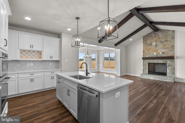 kitchen featuring dark wood-type flooring, white cabinetry, and stainless steel appliances