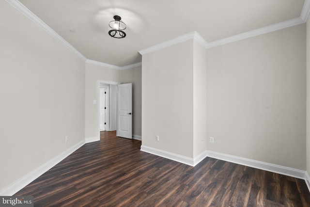 spare room with ornamental molding and dark hardwood / wood-style flooring