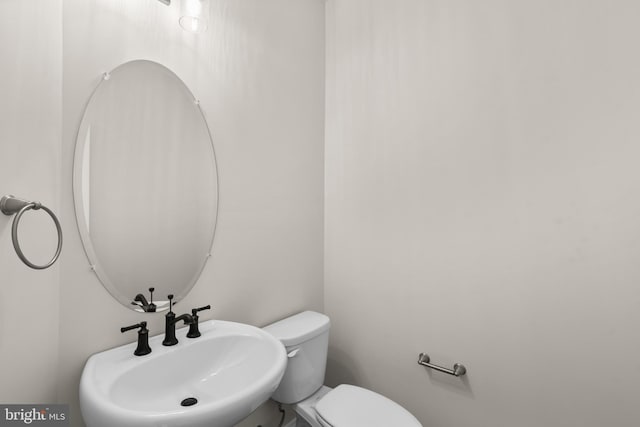 bathroom featuring sink and toilet