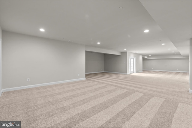 basement with light colored carpet